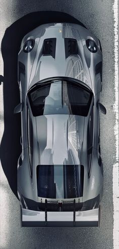 an overhead view of a silver sports car