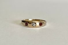 Garnet Starburst Ring, Victorian 14k Gold Diamond Ring With Gemstone, Vintage Multi-stone Ruby Ring In 14k Gold, Vintage Rose Gold Diamond Ring With Gemstone, Vintage Yellow Gold Three Stone Jewelry, Vintage Yellow Gold Three-stone Jewelry, Antique Three-stone Ruby Wedding Ring, Vintage 14k Gold Ruby Ring With Diamonds, Victorian Ruby Jewelry With Single Cut Diamonds