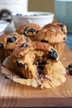 blueberry muffins cut in half on a cutting board