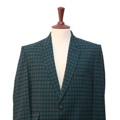 This Chiragh Apparel blazer is an elegant upgrade on dapper tailoring and features rich shades in a sumptuous fabric for elegant opulence. Fashioned from premium quality wool, this check plaid blazer features full lining in Japanese silk, a notch lapel, two-button closure and single-vented back. A left chest pocket and three flap pockets appoint the front while the inside has two (2) pockets on the left and one (1) pocket on the right. A flash of contrast piping is added to the jacket lining ins Bespoke Fitted Blazer For Formal Occasions, Wool Tailored Blazer For Wedding, Tailored Wool Wedding Blazer, Fitted Tweed Jacket With Long Sleeves For Semi-formal Occasions, Elegant Tweed Jacket For Office, Fitted Long Sleeve Tweed Jacket For Semi-formal Occasions, Fitted Green Sport Coat For Semi-formal Occasions, Bespoke Tailored Tweed Jacket For Formal Occasions, Bespoke Tailored Tweed Jacket For Formal Events