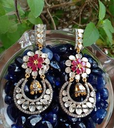 Item-SilverBrand : Jaysee JewellersCountry/Region of Manufacture: IndiaMetal Purity: 925 parts per 1000Main Stone Color - whiteMain Stone :Polki DiamondSecondary Stone : Ruby,Pave DiamondGross Weight - 26.00 Gram Length : 67 mmWidth : 29 mmPolki Diamond & Ruby Gemstone Dangle Earrings, Silver Jewelry.Special customize for Mother's day, Anniversary, Birthday Gift, Valentine, Christmas. Traditional Silver Earrings With Elegant Design, Dazzling Hand Set Dangle Earrings, Hand Set White Gold Drop Bridal Earrings, Hand Set White Gold Bridal Drop Earrings, White Gold Pearl Earrings With 17 Jewels For Wedding, Hand Set Teardrop Bridal Earrings In Fine Jewelry Style, Exquisite Sterling Silver Bridal Earrings, Luxury Rose Cut Diamond Chandelier Earrings For Wedding, Hand Set Teardrop Bridal Earrings Fine Jewelry