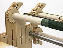 a close up of a machine made out of wood and metal bars on a white background