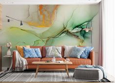 a living room filled with furniture and a painting on the wall above it's couch