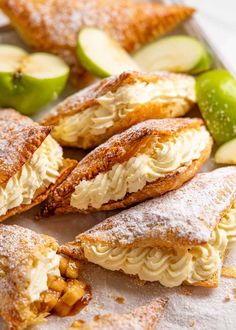 apple turnovers with powdered sugar and sliced apples