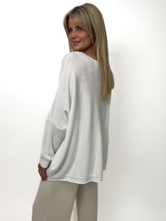 This Jumper features: Long Sleeved Jumper Two front pockets Super soft cashmere feel Designed for a relaxed fit White Cashmere V-neck Sweater For Fall, White Soft Knit V-neck Sweater For Layering, Oversized Relaxed Knit Tops, Casual White Cashmere V-neck Sweater, Casual White Long Sleeve Loungewear Top, Cozy Cashmere Crew Neck Top, Oversized Fine Knit Crew Neck Top, Cozy Cashmere Tops For Layering, Relaxed Long Sleeve Tops With Soft Texture