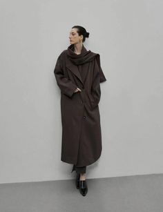 Brown oversized scarf coat 73% polyester, 20% viscose, 7% elastane Fit is oversized Side pocketsAttached oversized scarf Bust 50"/ 125 cmTotal length 49"/124 cm Imported Oversized Long Brown Outerwear, Oversized Solid Color Cape Outerwear, Oversized Long Outerwear For Work, Baggy Workwear Outerwear With Pockets, Oversized Shawl Collar Outerwear For Winter, Baggy Fall Outerwear For Work, Modern Oversized Long Coat, Scarf Coat, Brown Scarf