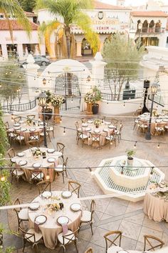 tables and chairs are set up in an outdoor courtyard