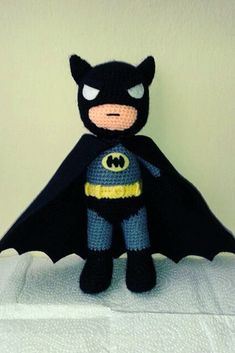 a stuffed toy with a batman costume on