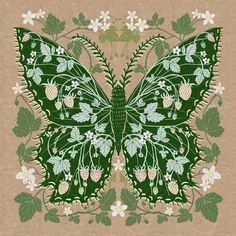 a green butterfly with white flowers and leaves on it's wings, sitting on a piece of brown paper