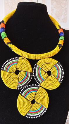 African Yellow Zulu Pendant Necklace, African Beaded Necklace, African Jewelry, Tribal Necklace, Gif Yellow Beaded Bib Necklaces With Round Beads, Yellow Beaded Pendant Jewelry, Yellow Beaded Pendant Necklace, Colorful Beaded Necklaces In Yellow, African Shells, African Beaded Necklace, Pear Shaped Diamond Necklace, African Beads Necklace, Seashell Bracelet