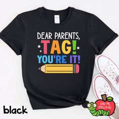 a t - shirt that says dear parents, tag you're it with pencils