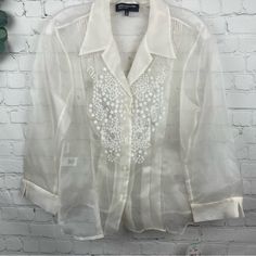 Jones New York Collection Nwt Ivory Embroidered Silk Sheer Blouse Button Front; Pleated Detail; Pintuck At Shoulders Notched Cuffs Nwt (Only 1 Piece Available) Size: 8 Approx. Flat Measurments: P2p: 18" Length: 24" 366 Formal Embroidered Button-up Shirt, Spring Formal Embroidered Shirt, Embroidered Collared Tops For Formal Occasions, Classic Formal Tops With Floral Embroidery, Elegant Embroidered Button-up Blouse, Elegant Button-up Top With Floral Embroidery, Elegant Floral Embroidery Button-up Tops, White Button-up Top For Wedding, White Button Closure Top For Wedding