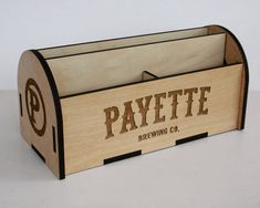 a wooden box with the word payette carved into it's sides and bottom