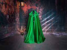 A basic, wide, unlined satin cloak is the perfect complement to any costume because of its magical, shiny, lightweight fabric. The cloak fastens at the front with a small hook in a fantasy style, and at the back the cloak has a very large hood to cover your head comfortably. The outer part of the cloak  is very soft and gentle to the touch. The cloak is easy to wash or clean, and raindrops dry on it quite quickly. The cloak is made of high quality 100% cotton satin (faux silk) and has no lining Cape Costumes For Cosplay And Fantasy Events, Fantasy Cape Costume For Cosplay Events, Cosplay Cape Costume For Fantasy Events, Fantasy Cape For Cosplay Events, Fantasy Cape For Cosplay And Fantasy Events, Elven Style Cape For Cosplay, Elvish Cape For Halloween Cosplay, Elvish Halloween Cosplay Cape, Elven Style Cape For Costume Party