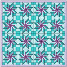 a blue and purple quilt with an intricate design on the front, along with pink flowers