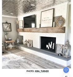 a living room filled with furniture and a fire place