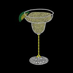 a martini glass with a green garnish on the rim