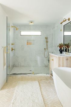 a bathroom with a shower, toilet and sink