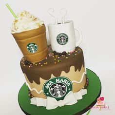 there is a starbucks cake with two cups on top