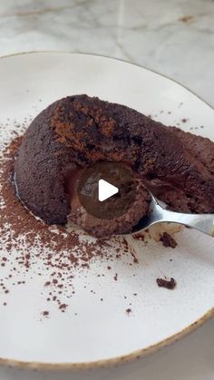 a spoon with some chocolate cake on it