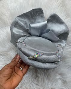 Silver Zara turban cap is made for women that love unique designs, comfortable turbans and elegant outfits. It's an African headwear style that fits Lace dress, Ankara wear, Asoebi clothes, traditional wedding clothing and Some English dresses. Perfect wear for Weddings, cultural festivals and church events. We can design it with your choice of fabric and in any colour of choice. For bulk orders or further colour specifications, you can send me a message I create headwears to perfection and I wi Culture Outfits Traditional Dresses, Elegant Turban Styles, Ladies Caps Fashion, Ladies Cap, Fascinator Designs, Turbans For Women, Turban Cap Style, Zara Cap Styles, Turban Cap