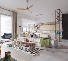 a living room filled with lots of furniture next to a large window covered in curtains