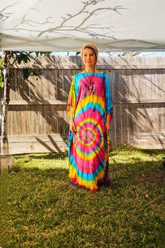 "Add a touch of unique style to your wardrobe with our Hand-Dyed Kaftan Dress! This stunning dress is made from 100% breathable and comfy rayon fabric, ensuring maximum comfort all day long. Using our unique method, each dress is carefully hand dyed, resulting in a one-of-a- kind masterpiece. The intricate patterns and vibrant colors make this dress a true work of art. The kaftan dress comes in a versatile one size fits most (M-3XL), making it extremely comfortable for a wide range of body types. With a bust measurement of up to 60\", you can feel confident that this dress will flatter your figure. The dress measures 55\" in length and 45\" in width, providing a loose and flowing fit that is both stylish and flattering. Featuring a trendy boat neck design and side slits, this slipover styl