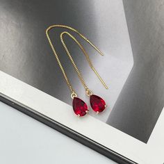 Ruby Red Thread Teardrop Earrings, Cerise Bright Red Crystal Earrings, Statement Earrings, Long Ruby Earrings, Scarlet Red Thread Earrings. These are simple and beautiful ruby red teardrop crystal earrings. Bright red crystals are framed in bright gold and dangling from long thread. Measurements: The total length from the top of the hook to bottom - 3.74 inches (95 mm) approximately. Crystals: 10 mm x 6 mm The earrings would be a PERFECT GIFT for you and your family and friends! Click here to se Hummingbird Necklace, Emerald Green Earrings, Prom Earrings, Red Thread, Thread Earrings, Ruby Earrings, Star Ruby, Earrings Red, Threader Earrings