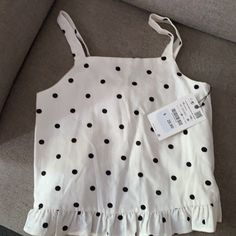 Nwt Polka Dot Zara Girl’s Top With Ruffles On The Bottom. 100% Cotton, Linen Like Cute Polka Dot Top For Spring, Cute Spring Polka Dot Tops, Cute Polka Dot Sleeveless Top, Polka Dot Sleeveless Cotton Top, Sleeveless Polka-dotted Cotton Top, Sleeveless Polka Dot Cotton Tops, Cute Zara Cotton Tops, Cute Zara Tops For Summer, Spring Polka Dot Cotton Tops