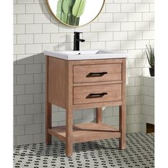 a bathroom vanity with a mirror above it and a plant in the corner on the wall