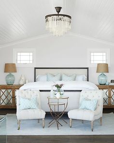 a bed and two chairs are featured in the beach house style magazine, which is on sale