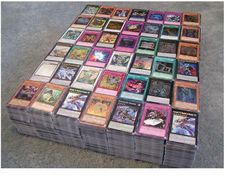 a pile of cards sitting on top of a floor