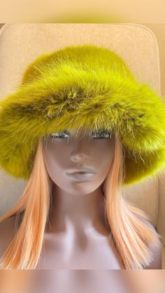 In this picture:
 • fur hat
 • bucket hat
 • black women
 • spring fashion
 • fall fashion
 • winter fashion Fluffy Faux Fur Hat For Fall, Adjustable Winter Hat With Feather Trim, Winter Fedora Hat With Feather Trim, Winter Fedora With Feather Trim, Green Brimmed Winter Costume Hats, Winter Party Cloche Hat With Wide Brim, Faux Fur Hat For Fall, Winter Hat With Feather Trim, Winter Bucket Hat One Size