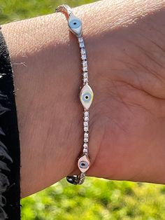 Gorgeous Classy Glamorous Evil Eye Tennis Bracelet Sterling Silver 92.5 Tennis Bracelet  With cubic zirconia stones . Bracelet measures from 6-7.2 inches  Adjustable bracelet with lobster clasp Add extra protection to your daily outfits with this precious evil eye 🧿 bracelet 🥰 Evil eye jewelry is well known for good luck and protection. Silver Evil Eye Bracelet Spiritual Style, Silver Evil Eye Bracelet Gift, Silver Hypoallergenic Evil Eye Bracelet Gift, Evil Eye Tennis Bracelet, Adjustable Blue Evil Eye Bracelet, Nickel Free, Adjustable Sterling Silver Evil Eye Bracelet, Spiritual Style, Protection Bracelet, Evil Eye Bracelet, Tennis Bracelet