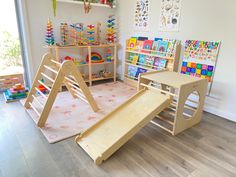 a child's play room with toys and bookshelves