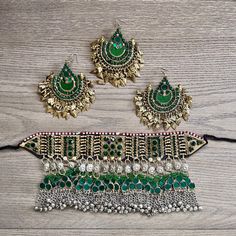 Beautiful handmade vintage Kuchi choker set would be the perfect set for your special event!  This set will make a statement and stand out with its beautiful uniform green glass stones and charming bells.  The Kuchi people are nomads and travel around different parts of Asia leaving behind beautiful pieces behind like this one.  This set is believed to be from the early 2000's and the entire piece is in immaculate condition aside from some oxidization or patina. This unique Kuchi set is outstand Green Metal Choker For Party, Ceremonial Green Jewelry Sets For Festivals, Traditional Green Metal Jewelry Sets, Traditional Green Ceremonial Choker, Green Metal Jewelry For Festivals, Handmade Green Choker For Celebration, Green Metal Jewelry Sets For Wedding, Green Festive Jewelry Set For Ceremonial Occasions, Green Ceremonial Jewelry Set For Festive Occasions