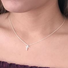 This tiny silver cross necklace is a classic addition to your layering necklaces. This minimalist necklace is also perfect by itself. The cross charm is sterling silver and measures approximately 12 mm in length or 1/2 inch. The chain is delicate looking but sturdy sterling silver. This dainty cross necklace is available in lengths from 15 - 18 inches. You may choose to add an attached extender. Your new necklace will come in a box, ready for gift giving. More Christian jewelry https://www.etsy. Minimalist Clavicle Chain Necklace With Cross Pendant, Minimalist Cross Pendant Necklace For Everyday, Minimalist Cross Pendant Necklace For Everyday Wear, Dainty Cross Necklace For Everyday Wear, Delicate Sterling Silver Cross Pendant Necklace, Dainty Charm Necklace With Clavicle Chain And Cross Pendant, Dainty Cross Pendant Charm Necklace With Clavicle Chain, Dainty Cross Necklace With Delicate Chain For Everyday, Minimalist Cross Necklace For Everyday