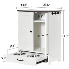 a white cabinet with drawers and pull out trays