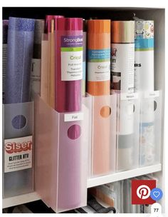 the shelf is filled with many different types of crafting supplies and storage bins