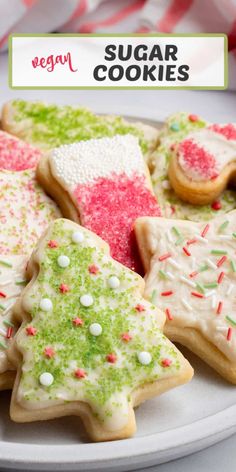 several decorated sugar cookies on a white plate