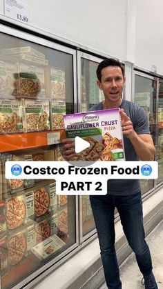 a man holding up a box of frozen food in front of a store window with the words costo frozen food part 2