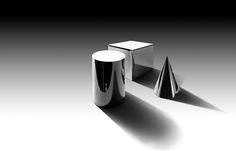 two silver objects sitting next to each other on a white surface in the middle of an empty room