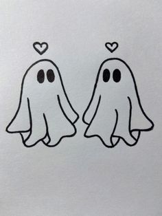 two ghost faces with hearts on their foreheads, drawn in black and white paper