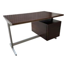 a wooden desk with two drawers on each side and a metal frame around the edge