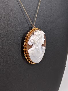 This piece is made of 10k yellow gold. The cameo is bezel set and has a twisted gold halo. The cameo is both a pendant and a brooch. The cameo is 47x33mm. Originally $800, but is now on sale for $550. (Chain not included, but can be provided upon additional purchase) Forever Rings, Victorian Rings, Cameo Necklace, Gold Halo, Jewel Box, Tennis Bracelet, Opal Rings, Bezel Setting, Beautiful Rings