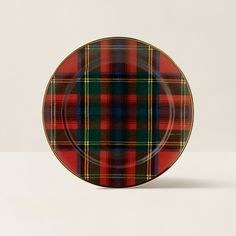 a red and green plaid plate on a white surface