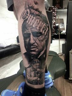 a man's leg with a tattoo on it that has the image of abraham lincoln