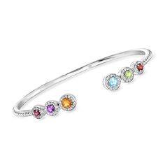 Ross-Simons - 1.29 ct. t. w. Multi-Gemstone Cuff Bracelet in Sterling Silver. 8". An RS exclusive. Add this beautiful cuff bracelet into the mix, and your stack will look better and brighter than ever before! Features vibrant .89 ct. tot. gem wt. rhodolite garnet, amethyst, citrine, Swiss blue topaz, peridot and garnet rounds encapsulated by shimmery .40 ct. t. w. white topaz halos. Crafted in sterling silver. Slip-on, multi-gemstone cuff bracelet. Garnet birthstones are the perfect gift for Jan Peridot And Garnet, Gemstone Cuff Bracelet, Pearl Jewelry Shop, Garnet Birthstone, Fine Jewelery, Mixed Metal Jewelry, Citrine Stone, Cz Stud Earrings, Yellow Stone