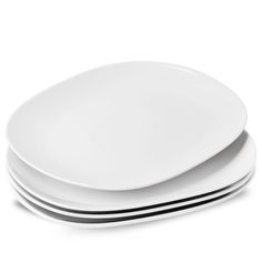 four white plates stacked on top of each other with black lines down the middle and sides