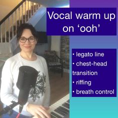 a woman wearing glasses and holding a microphone in front of a piano with the words vocal warm up on'ooh